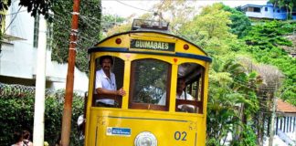 Yellow Cable Car on the cobblestone steets of Santa Teresa, Rio de Janeiro, Brazil.