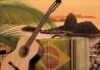 5 Not-To-Be-Missed Summer-Stretching Concerts Album cover art for 'Lovely Jazz Bossa Nova', depicting acoutstic guitar and Brazilian flag suitcase with Sugarloaf mountain the the backgorund