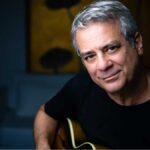 10 Questions with Guitarist Ricardo Silveira Brazilian guitarist Ricardo Silveira poses with a guitar .