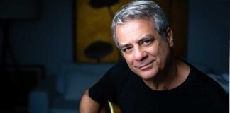 Brazilian guitarist Ricardo Silveira poses with a guitar .