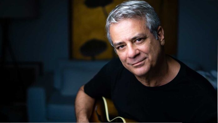 Brazilian guitarist Ricardo Silveira poses with a guitar .