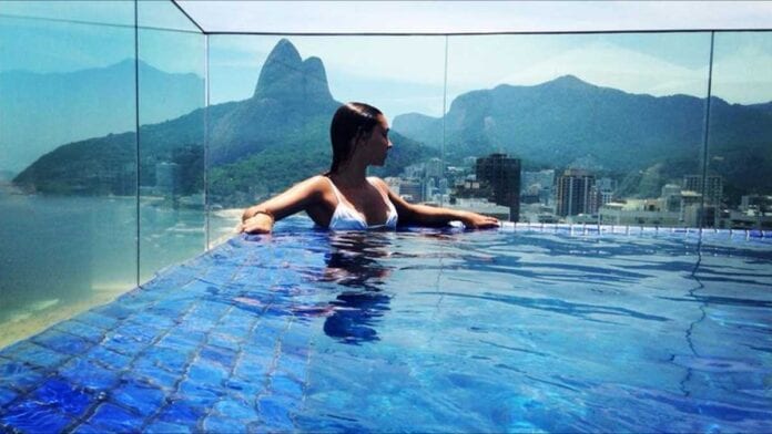 ipanema-rooftop-pool-crawl-connect-brazil-01 woman in ipanema pool