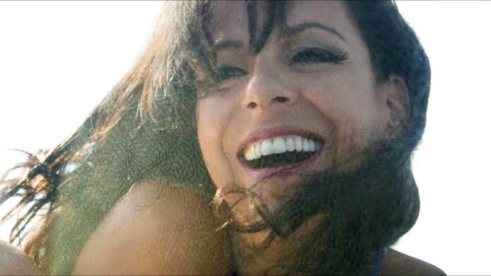 Brazilian singer Bebel Giberto smiles. Listen to the Women of Brazilian Song.