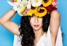 A New Song from Marisa Monte, pictured wearing sunflowers on her head.