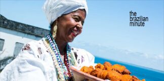 Baiana woman from Bahia holds a woven basket of Acaraje, African Culture in Brazil
