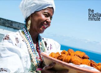 Baiana woman from Bahia holds a woven basket of Acaraje, African Culture in Brazil