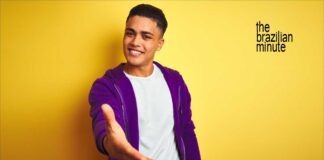 Experience Brazil's hospitality. Young Brazilian man extends his hand in friendship.