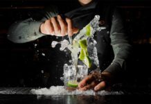 Bartender makingthe perfect caipirinha Brazilian cocktail.