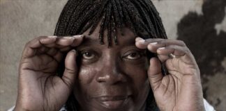 The Milton Nascimento Streaming Channel. Nascimento cups his hands around his eyes while smiling.