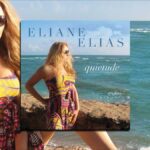 Eliane Elias’s Quietude Shares Personal Favorites . Brazilian jazz pianist and vocalist Eliane Elias Sits on stone wall near ocean