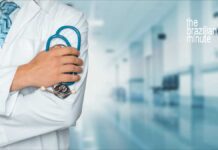 Brazil-US Cooperation in Health Sciences. Medical worker in white lab coat holding stethescope.