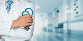 Brazil-US Cooperation in Health Sciences. Medical worker in white lab coat holding stethescope.