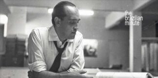 Understanding Brazilian Architect Oscar Niemeyer. A blacka nd white picute shows him at his design table.