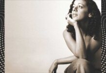 Relaxing Brazilian Music Streaming Channels: Brazilian woman sitting in a casual and calming pose.