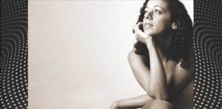 Relaxing Brazilian Music Streaming Channels: Brazilian woman sitting in a casual and calming pose.