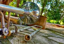 Roy Stephansen’s Musical Move Roy Stephansen's musical move. Silver trombone sits on a stone bench surrounded by park-like greenery.