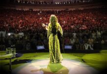 March salutes Brazils women of song, including singer Marisa Monte who faces the audience while performing.