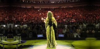 March salutes Brazils women of song, including singer Marisa Monte who faces the audience while performing.