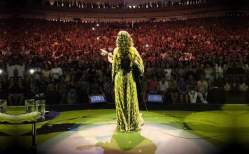 March salutes Brazils women of song, including singer Marisa Monte who faces the audience while performing.