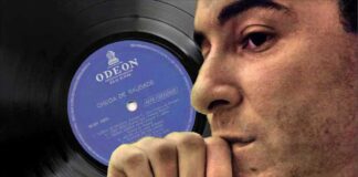 A world without Bossa Nova. Brazilian singer Joao Gilberto in profile with his debut record album in the background