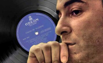 A world without Bossa Nova. Brazilian singer Joao Gilberto in profile with his debut record album in the background