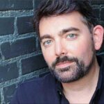 Bossa crooner Ryan DeHues had a year to remember in 2024. Here, Ryan poses for this image after his feature in JAZZIZ magazine.