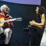 Marisa Monte and Gilberto Gil sing for peace on stage in Rio de Janeiro.