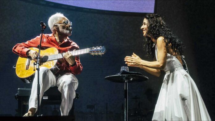 Marisa Monte and Gilberto Gil sing for peace on stage in Rio de Janeiro.